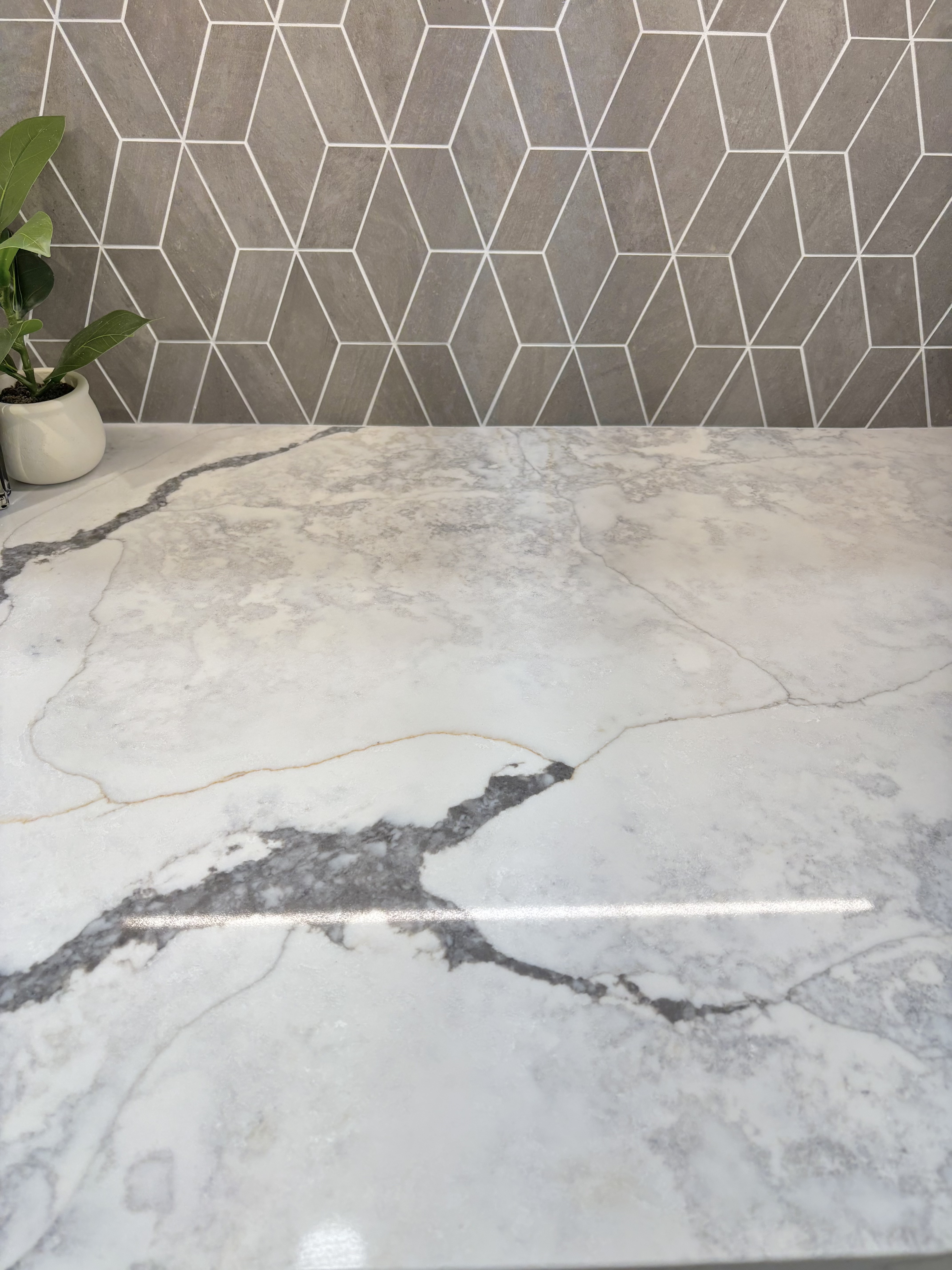 quartz countertop with light and dark gray marble veining. 
