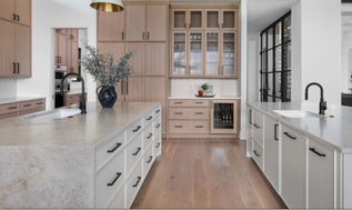 Soft white kitchen island with warm wood perimeter cabinets. Black hardware on all cabinets. Soft white kitchen island with warm wood perimeter cabinets. Black hardware on all cabinets.